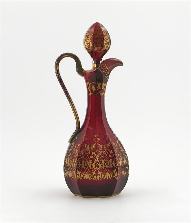 Appraisal: A ruby-flashed glass ewer and stopper