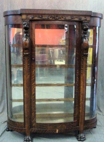 Appraisal: Highly Carved Oak Curved Glass China Cabinet with Claw Feet