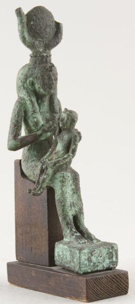 Appraisal: Egyptian Bronze Statuette depicts seated Isis suckling the infant Harpokrates