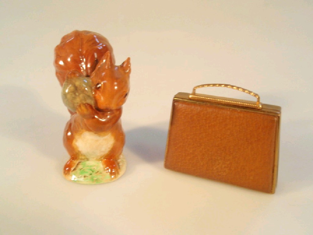 Appraisal: Beswick Beatrice Potter's Squirrel Nutkin and a mascot musical handbag