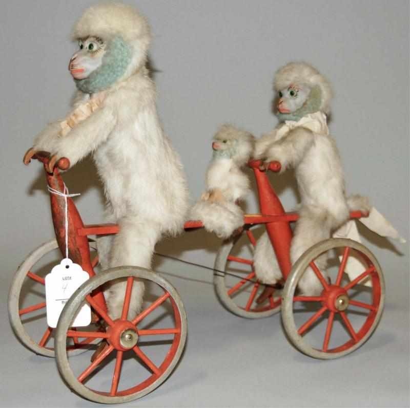 Appraisal: Monkey Pull Toy Three monkeys with rabbit fur on red