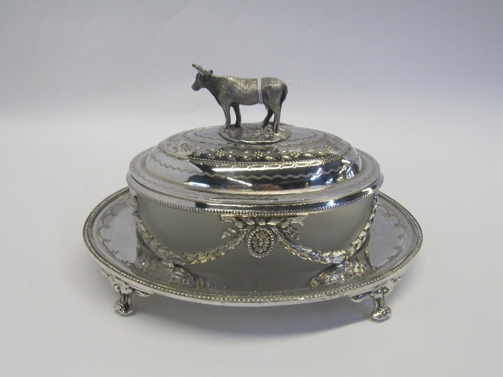 Appraisal: A silver plated butter dish with cow surmounted cover and