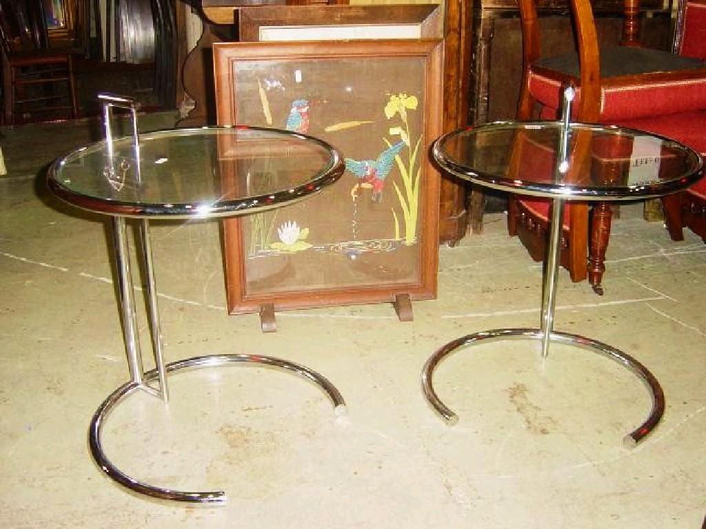 Appraisal: A pair of chromium plated steel occasional tables of stylised