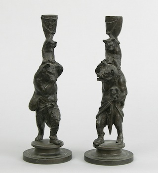 Appraisal: A Pair of Figural Candleholders of Bears A charming pair