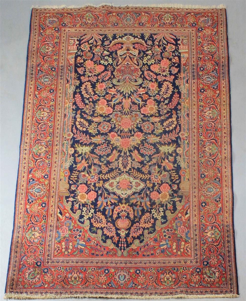 Appraisal: KASHAN GARDEN DESIGN ORIENTAL WOOL RUG having a red ground