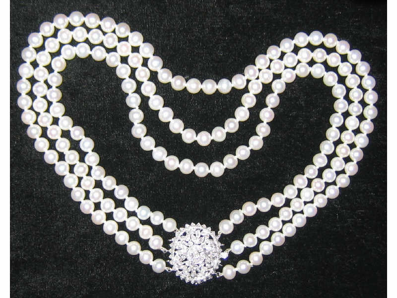 Appraisal: TRIPLE STRAND CULTURED PEARLS WITH DIAMOND CLASP k white gold