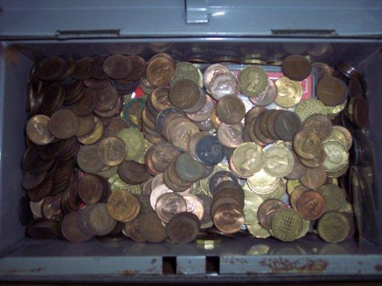 Appraisal: A cash box containing miscellaneous brass three pence pieces and