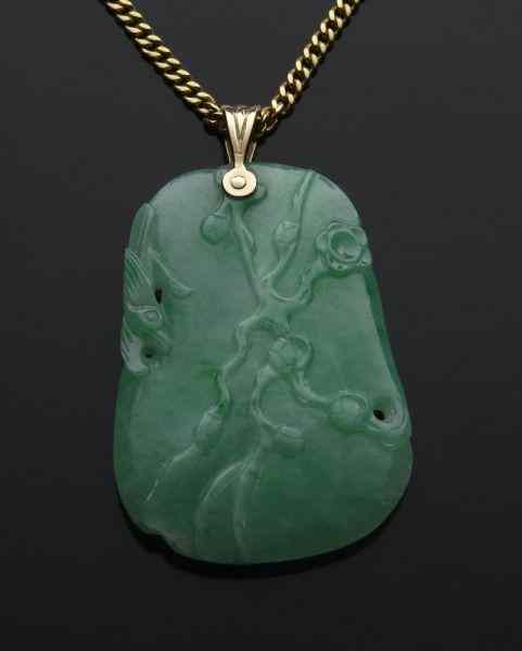 Appraisal: Chinese Qing carved jadeite pendant depicting a plum tree on