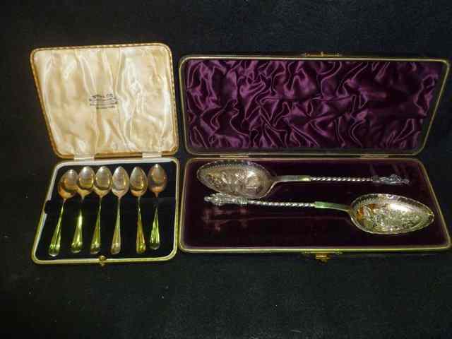 Appraisal: A CASED SET OF SILVER COFFEE SPOONS of stylised form