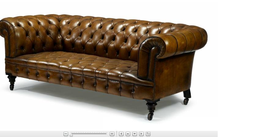 Appraisal: Victorian style brown leather ChesterfieldTufted back and hign scrolling arms