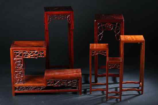 Appraisal: EIGHT CHINESE WOOD STANDS Four nested stands two square one