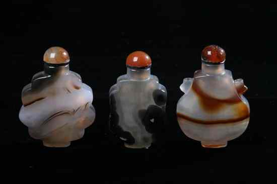 Appraisal: THREE CHINESE BANDED AGATE SNUFF BOTTLES Flattened form very well