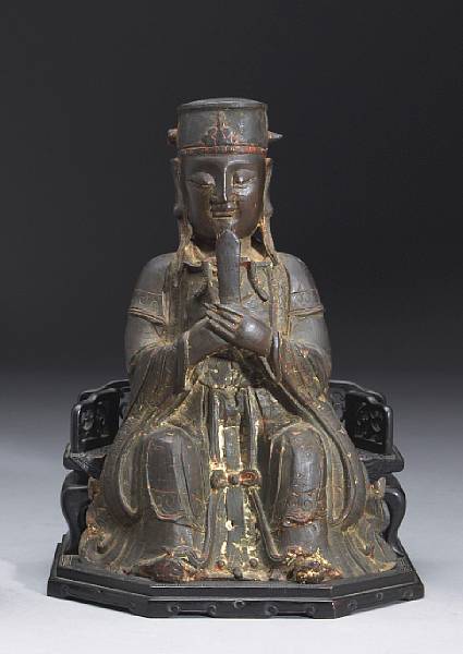 Appraisal: A bronze seated figure of Wenchang di gong Ming Dynasty