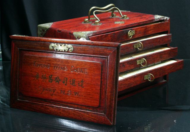 Appraisal: A Mahjong set in bone and bamboo in original brass