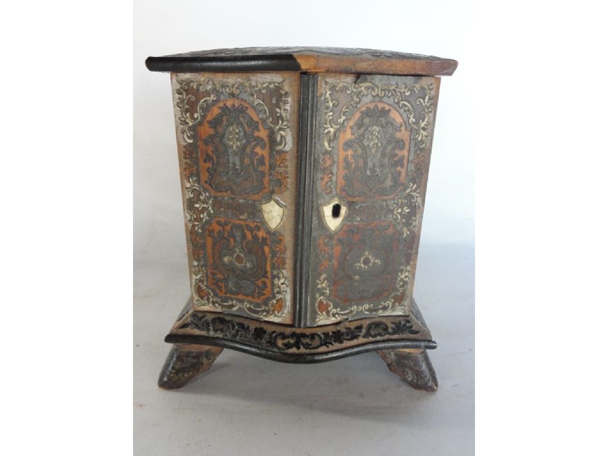 Appraisal: A miniature th century bank of three small drawers in