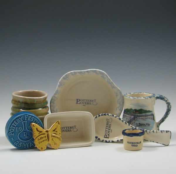 Appraisal: Eight Pottery Lovers Commemorative Pieces left blue paper weight reads