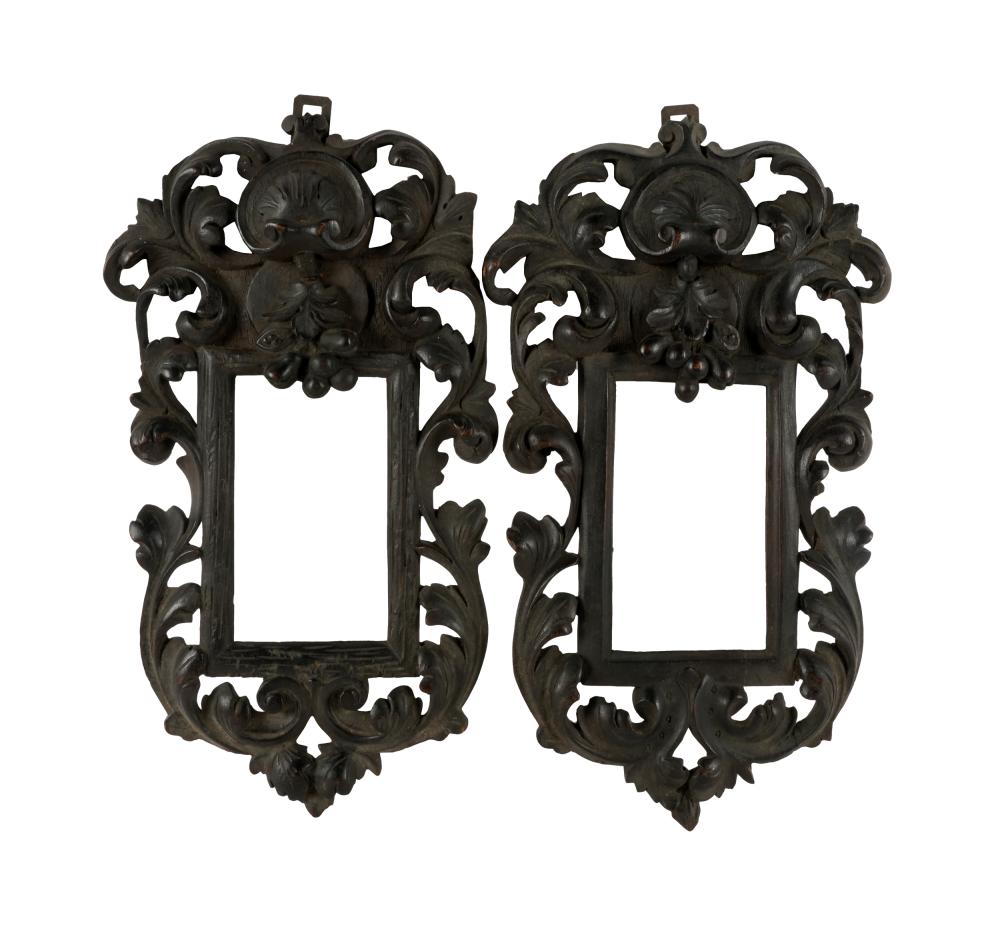 Appraisal: PAIR OF ITALIAN BAROQUE-STYLE CARVED WALNUT FRAMESeach with metal hanging