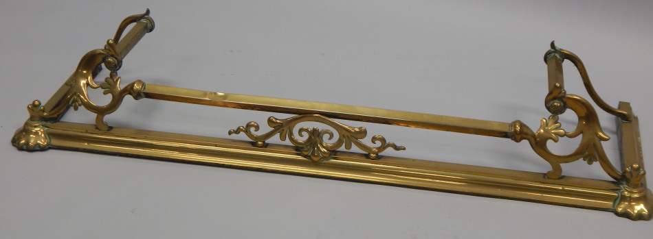 Appraisal: An Art Nouveau style brass fire curb with leaf cast