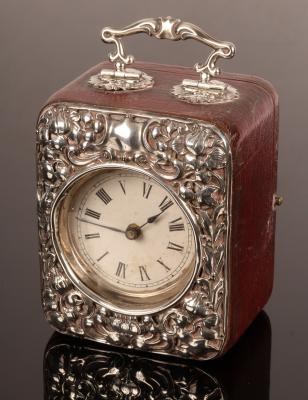 Appraisal: An embossed silver mounted travelling clock case with handle cm