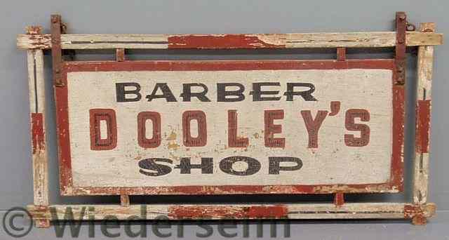 Appraisal: Trade sign Dooley's Barber Shop double sided paint decorated wood