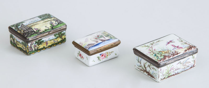 Appraisal: THREE ENAMEL SNUFF BOXES Comprising a Continental silver-mounted box with