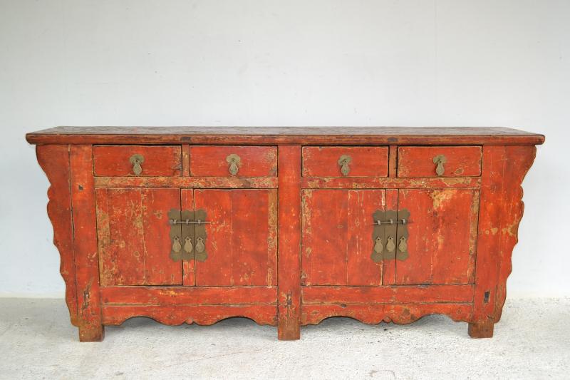 Appraisal: A RUSTIC ORIENTAL FOUR DRAWER SIDEBOARD IN RED CRACKLE DETAIL