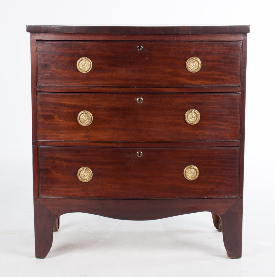 Appraisal: George III mahogany bachelor's chest circa diminutive three-drawer bow-front chest