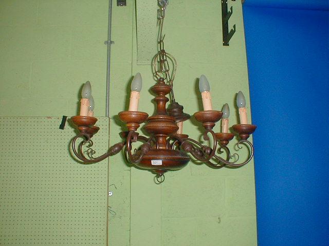 Appraisal: An eight light walnut and steel hanging centre light