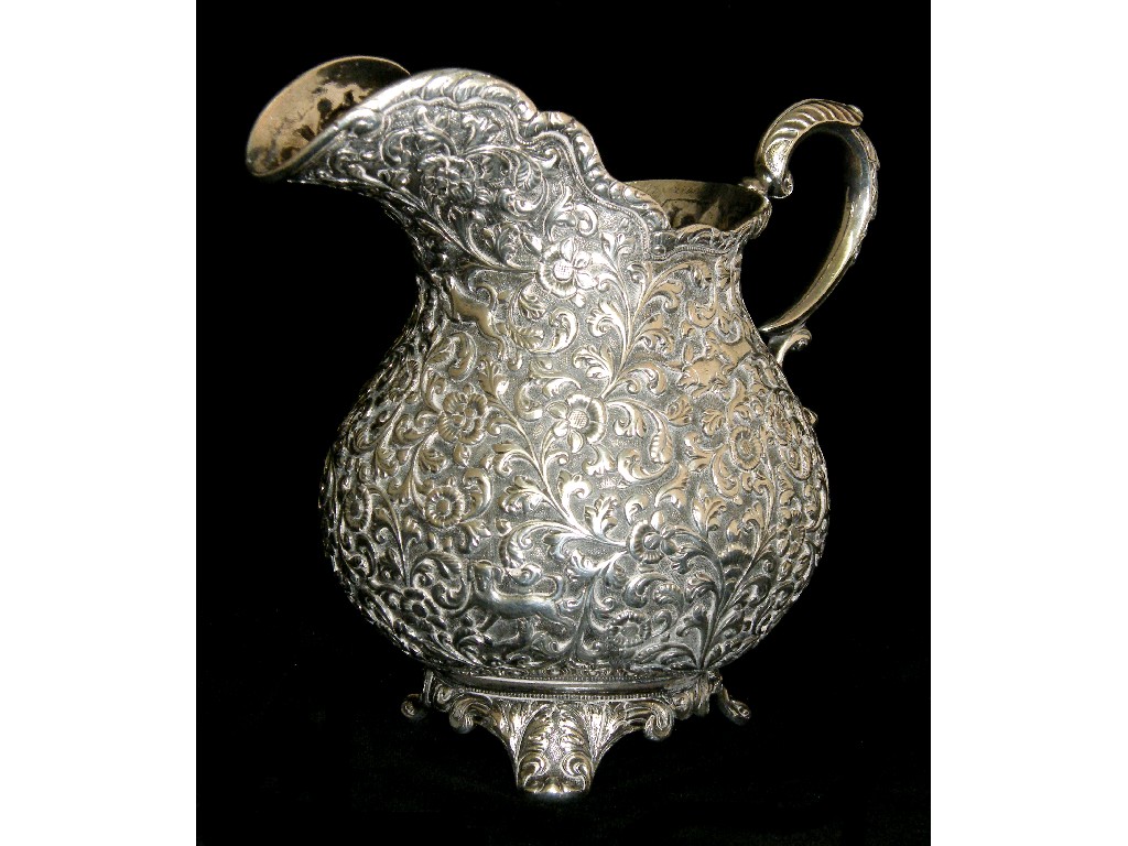 Appraisal: Good Indian white metal baluster jug profusely embossed with hounds