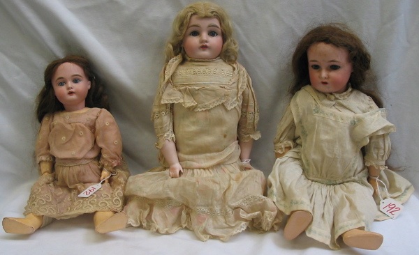 Appraisal: THREE GERMAN BISQUE HEAD ANTIQUE DOLLS One is a bisque