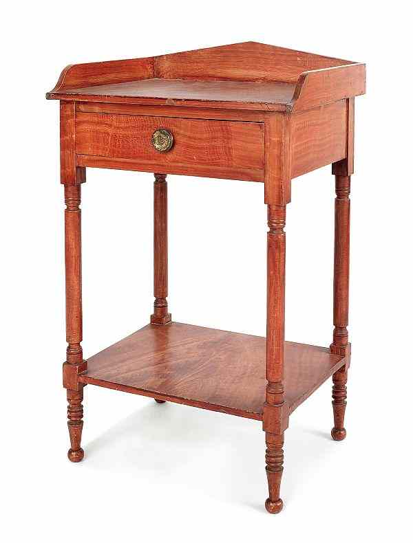 Appraisal: Pennsylvania painted poplar washstand ca retaining its original red grain