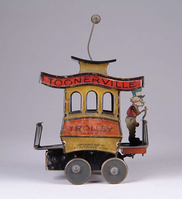 Appraisal: DITSLER TOONERVILLE TROLLEY Germany Comic character toy rolls forward with