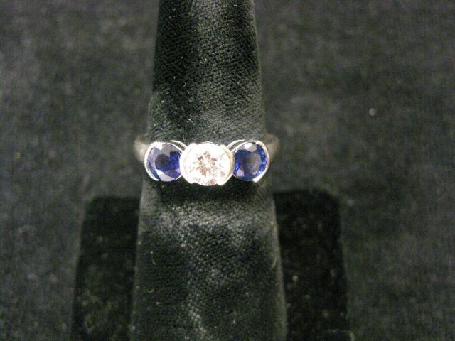 Appraisal: Sapphire Diamond Ring carat round diamond with deep blue sapphire