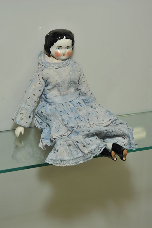 Appraisal: CHINA HEAD DOLL Having a cupid's bow mouth flat top