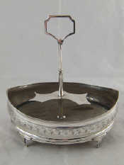 Appraisal: A Georgian silver navette shaped cruet stand on four shaped