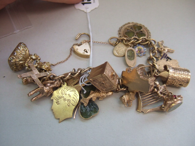 Appraisal: A ct gold curb link charm bracelet on a ct