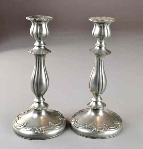 Appraisal: PAIR OF PEWTER CANDLESTICKSMatching pair of Baroque-style weighted pewter candsticks