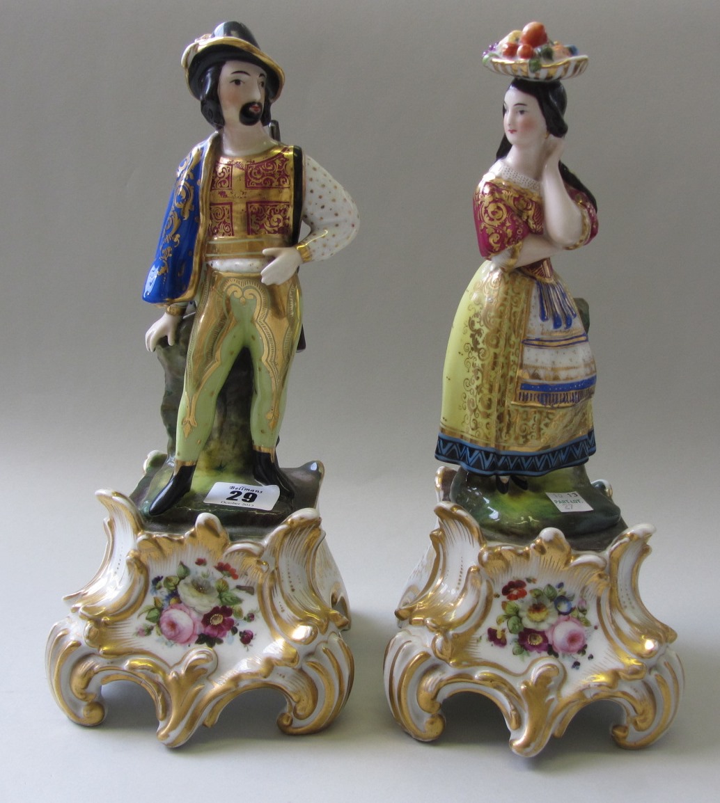 Appraisal: A pair of Jacob Petit style porcelain figures modelled as