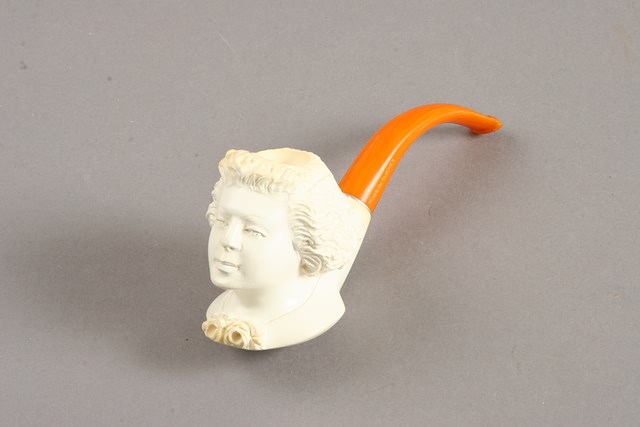 Appraisal: Bowl formed as head of man orange plastic stem l