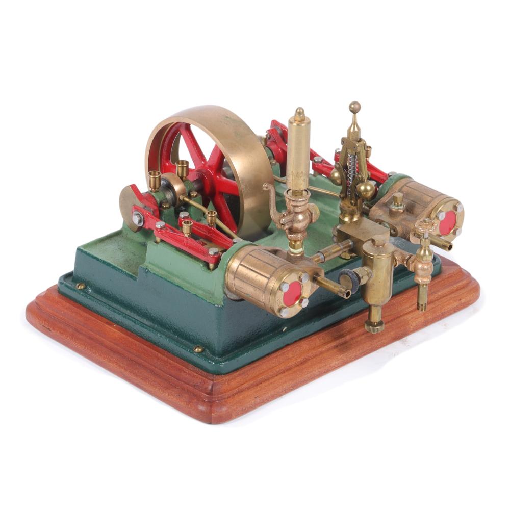 Appraisal: MODEL HAND BUILT STEAM ENGINE WITH LIVE STATIONARY TWIN PISTON