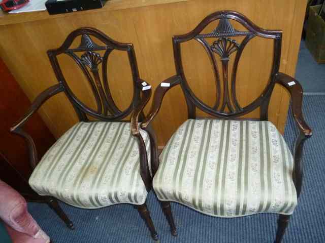 Appraisal: A PAIR OF GEORGIAN STYLE SHIELD BACK OPEN ARMCHAIRS with