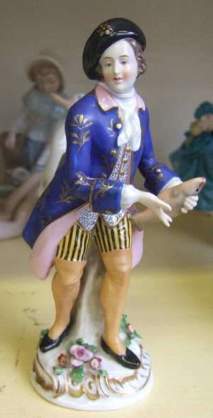 Appraisal: A continental porcelain figure modeled as a th century gentleman