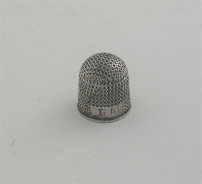 Appraisal: A George II th century squat thimble with a domed