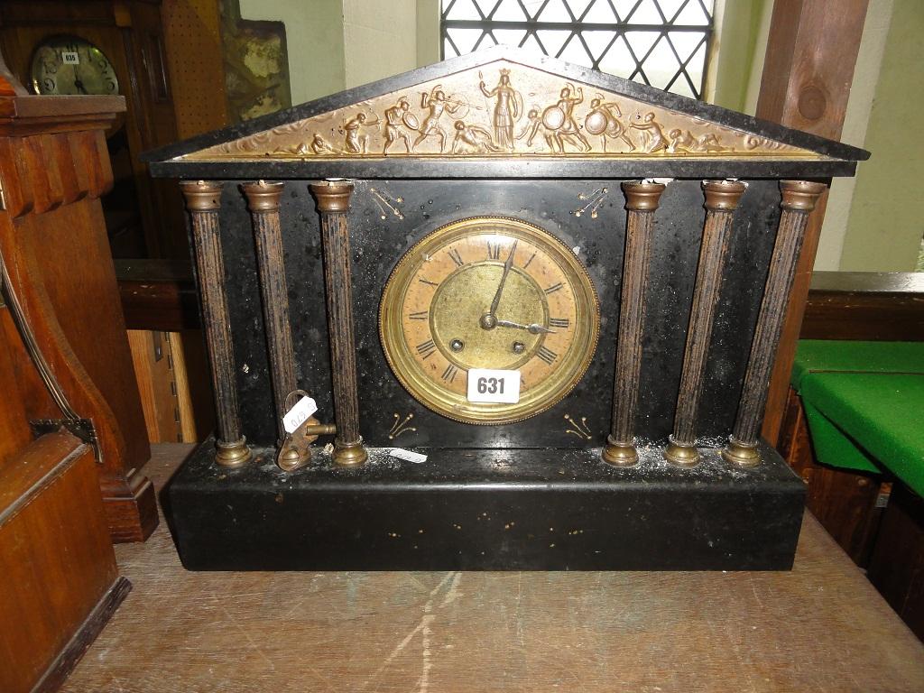 Appraisal: A Victorian classical style mantle clock in black slate with