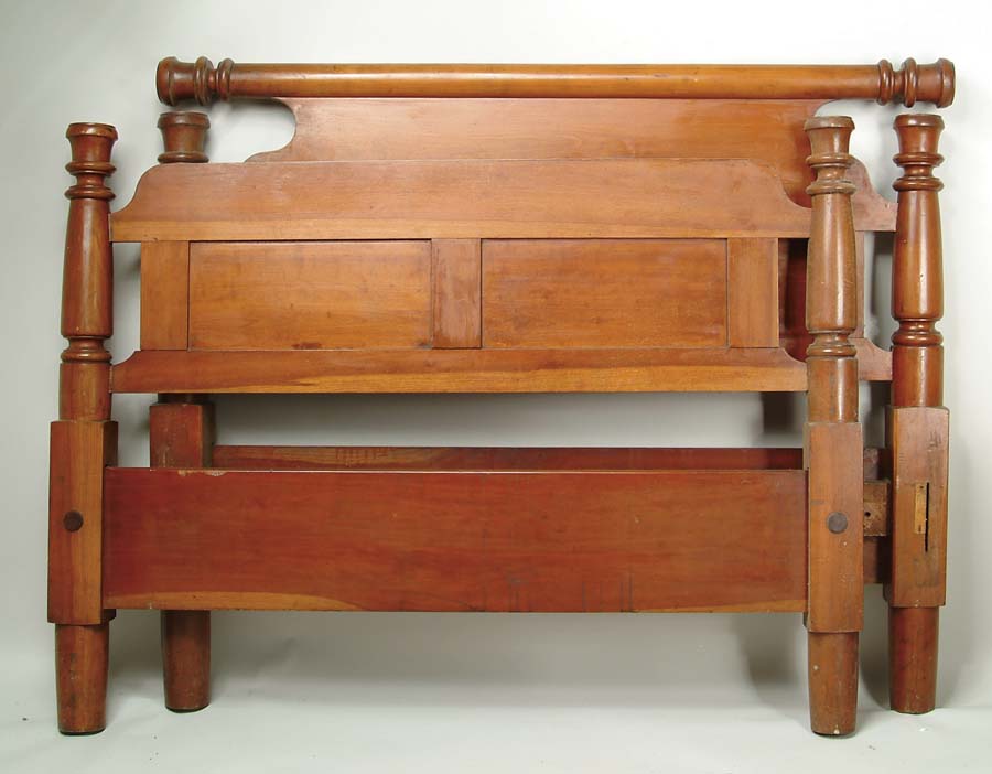 Appraisal: LARGE CHERRY ANTIQUE BED Turned posts hold large paneled headboard