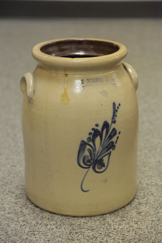 Appraisal: STONEWARE CROCK Two gallon crock with applied handles and stylized