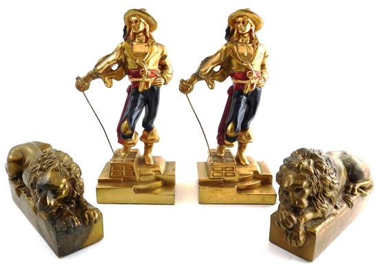 Appraisal: Two pairs of cast-metal th C bookends lion and swashbuckler