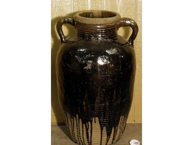 Appraisal: Monumental dark glazed double handled decorator vase measuring tall X