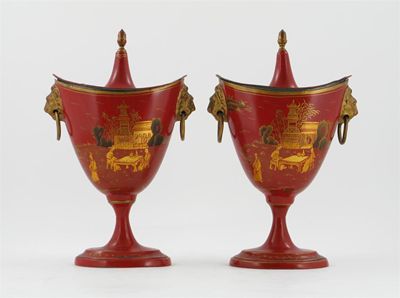 Appraisal: A pair of toleware chestnut urns and covers decorated with