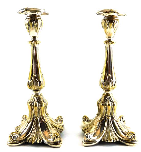 Appraisal: Pair of silverplate repousse candlesticks possibly Eastern European ornate foliate